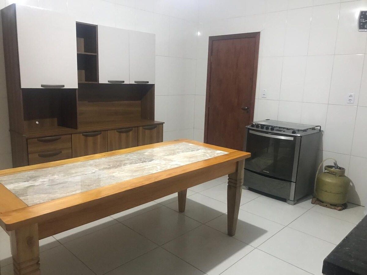Kitchen with a wooden table and stove