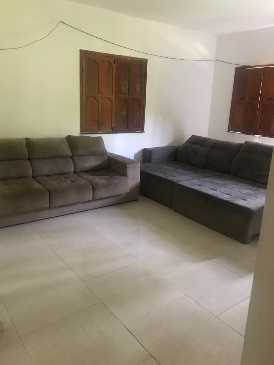 Living room with sofas and wooden shutters