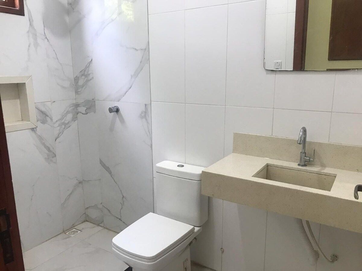Bathroom with toilet and stone basin